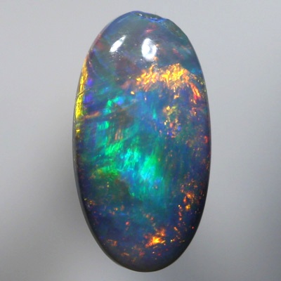 SOLID SEMI BLACK OPAL Golds over green and blue